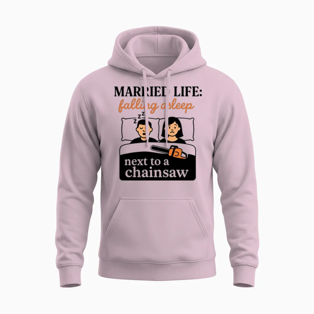 Married Life: Falling Asleep Next to a Chainsaw Unisex Hoodie in Light Pink