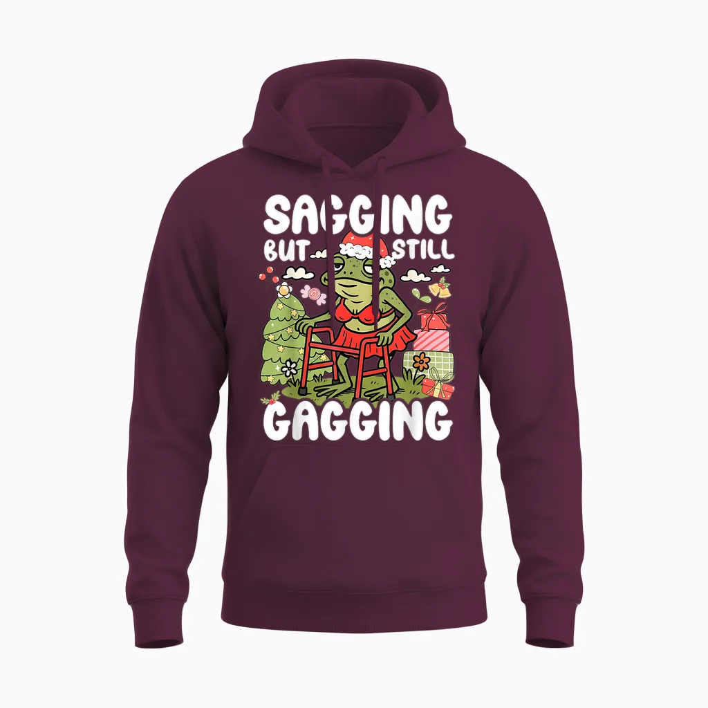 Sagging but Still Gagging Frog Funny Cringe Meme Christmas Unisex Hoodie in Maroon