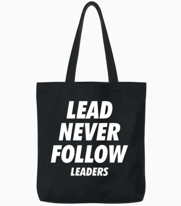 Lead Never Follow Leaders Tote Bags in Black