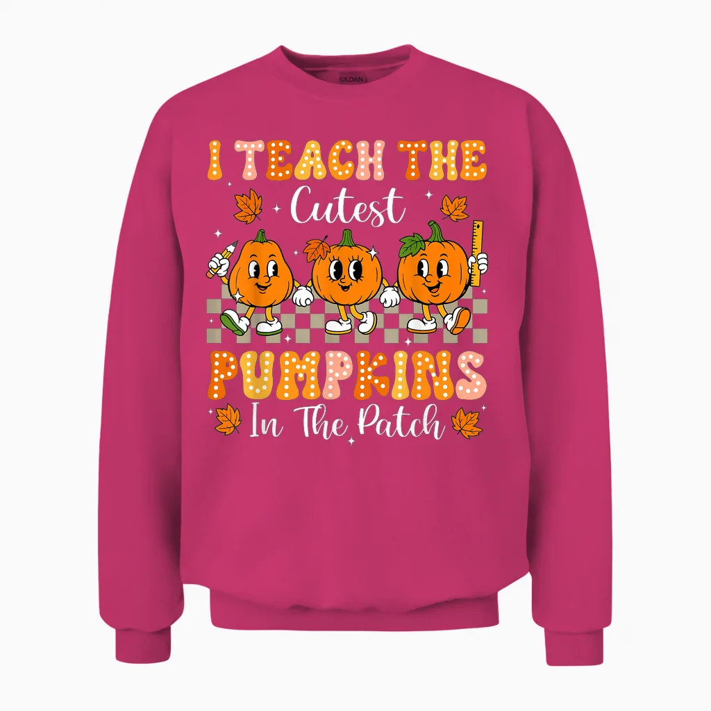I Teach the Cutest Pumpkins in the Patch Teacher Halloween Unisex Sweatshirt in Heliconia