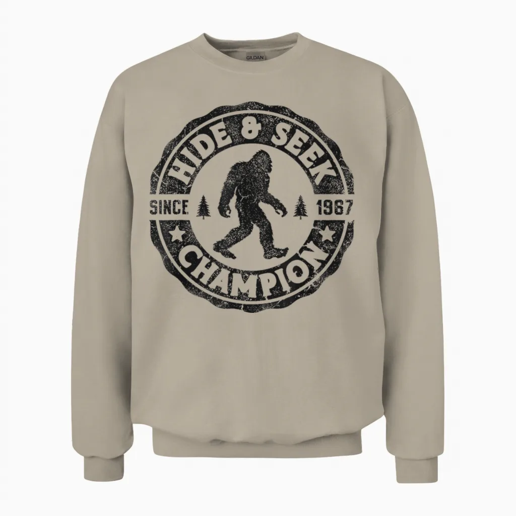 Bigfoot Hide and Seek Champion Funny Sasquatch Retro Vintage Unisex Sweatshirt in Sand